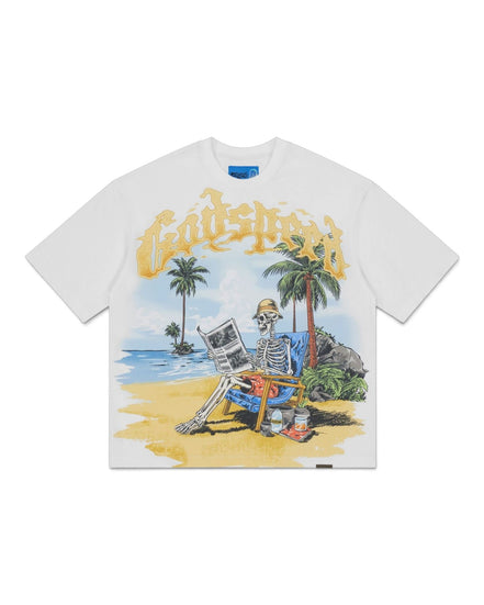 A white short-sleeve t-shirt featuring a colorful graphic print of a skeleton sitting on a beach chair on a tropical beach, with the word 'Godspeed' written in a yellow gothic font above it.