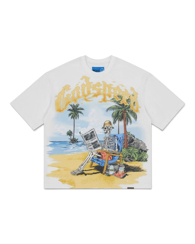 A white short-sleeve t-shirt featuring a colorful graphic print of a skeleton sitting on a beach chair on a tropical beach, with the word 'Godspeed' written in a yellow gothic font above it.