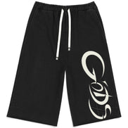Black drawstring shorts with a large white graphic logo on the lower right leg, displayed flat against a white background.