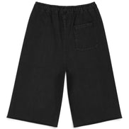 Black wide-leg shorts with an elastic waistband and a single patch pocket on the left side, shown flat on a white background.