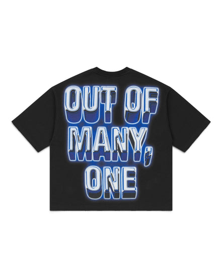 A black short-sleeve t-shirt with a large graphic text print on the front reading 'OUT OF MANY, ONE' in white letters with a blue 3D shadow effect, displayed on a solid white background.