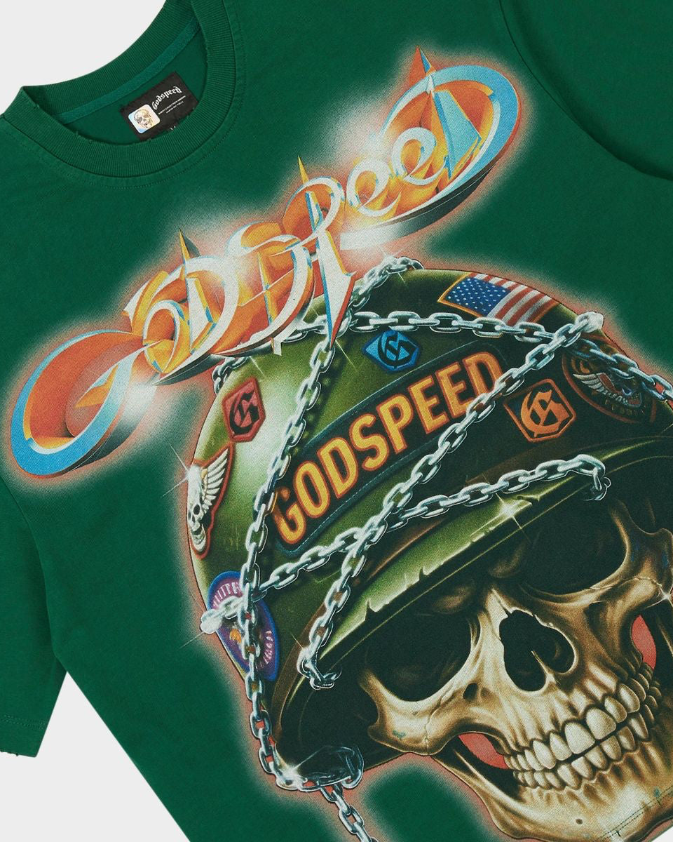A close-up of a dark green t-shirt featuring a large graphic print of a skull wearing a military helmet with 'Godspeed' written on it, under a stylized 'Godspeed' logo.