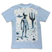 A light blue short-sleeve t-shirt with a large graphic print on the back featuring a gray alien, a cactus, a flying saucer, and the word 'INVASION' in distressed white letters.