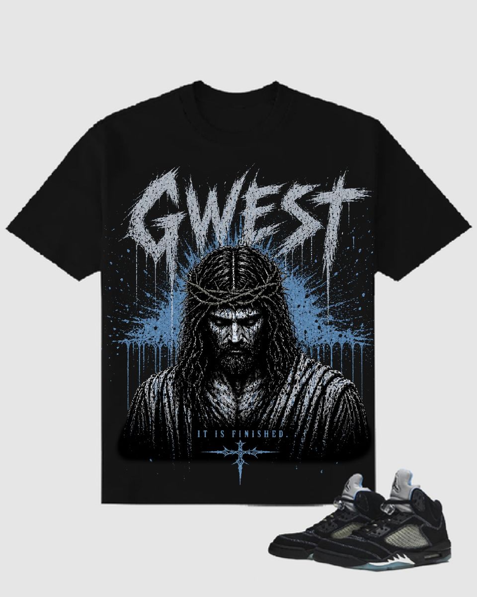 Black t-shirt with graphic design and text, paired with a black sneaker on a light gray background