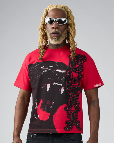 Person wearing a red t-shirt with a black panther graphic and text on a gray background