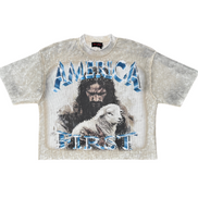 KHAKI t-shirt with graphic design of a man and lamb with 'AMERICA FIRST' text on a white background