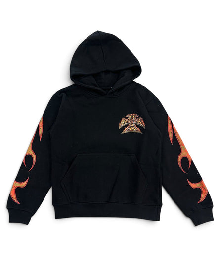 A black pullover hoodie featuring a small gothic-style cross emblem on the left chest and orange flame graphics running down both sleeves, displayed against a solid white background.