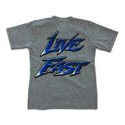 A heather gray short-sleeve t-shirt shown from the back, featuring a large graphic print of the words 'LIVE FAST' in a stylized blue and black font.