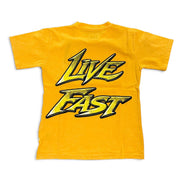 A yellow short-sleeve t-shirt with a large graphic print on the front reading 'LIVE FAST' in a stylized yellow and black font, shown against a plain white background.