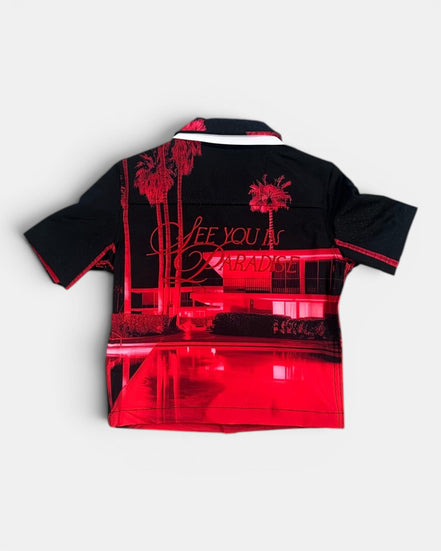 Black and red shirt with palm tree and text design on a white background