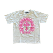 White t-shirt with pink graphic design on a white background