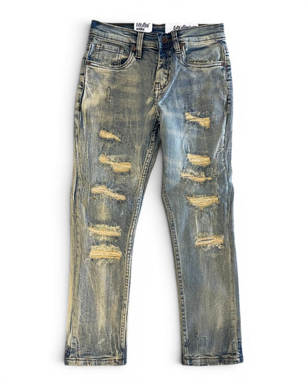 Distressed blue jeans on a white background