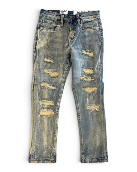 Distressed blue jeans on a white background