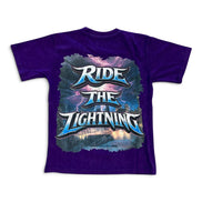 A purple short-sleeve t-shirt with a large graphic on the front reading 'RIDE THE LIGHTNING' in stylized blue and white lettering over a stormy sky and lightning design.