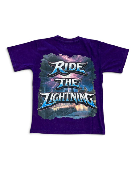 A purple short-sleeve t-shirt with a large graphic on the front reading 'RIDE THE LIGHTNING' in stylized blue and white lettering over a stormy sky and lightning design.