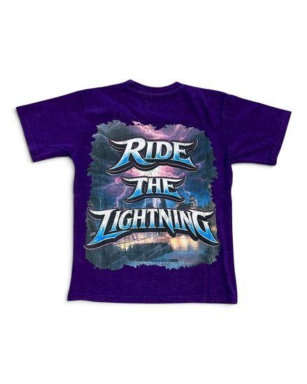 A purple short-sleeve t-shirt with a large graphic on the front reading 'RIDE THE LIGHTNING' in stylized blue and white lettering over a stormy sky and lightning design.
