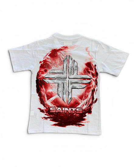 A white short-sleeve t-shirt featuring a large graphic print on the front. The design shows a metallic silver cross inside a circular red and black textured background, with the word 'SAINTS' printed below in red and silver.