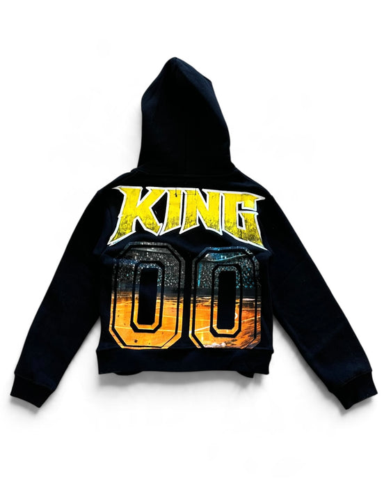 A black cropped hoodie with a large graphic print on the front featuring the word 'KING' in yellow and the number '00' in a gold-to-orange gradient.
