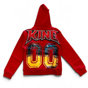 A red hooded sweatshirt shown from the back, featuring a large graphic print with the word 'KING' in stylized red letters above two large '00' numbers filled with a yellow-to-blue gradient and a basketball court scene.