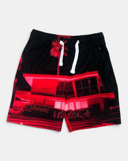 Black shorts with red graphic design on a white background