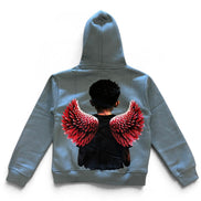 A gray hoodie shown from the back, featuring a graphic print of a person with short black hair and large red and black angel wings.