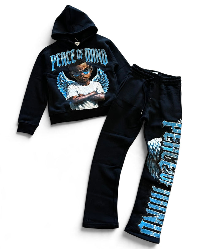 A two-piece kids' tracksuit set consisting of a black cropped hoodie with a 'Peace of Mind' angel graphic and matching black sweatpants featuring a large vertical graphic on the leg, laid out on a white background.
