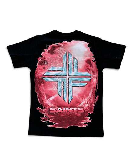 A black short-sleeve t-shirt featuring a large graphic print on the front. The design shows a metallic silver cross symbol layered over a pink and red textured circular background, with the word 'SAINTS' printed in red below.