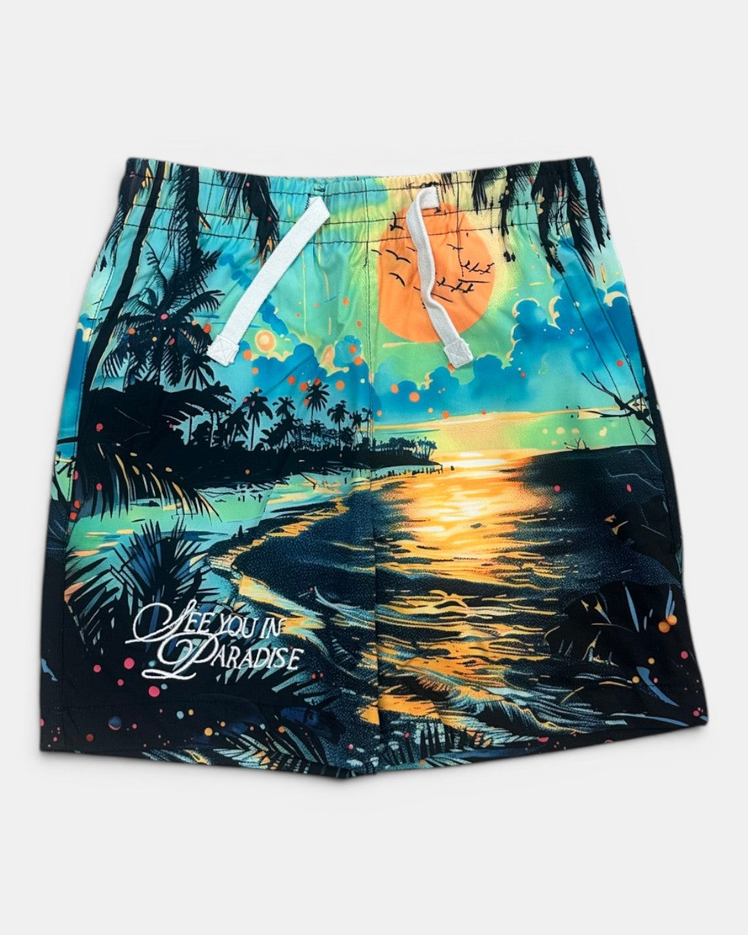 Colorful beach-themed shorts with a sunset design and text on a white background