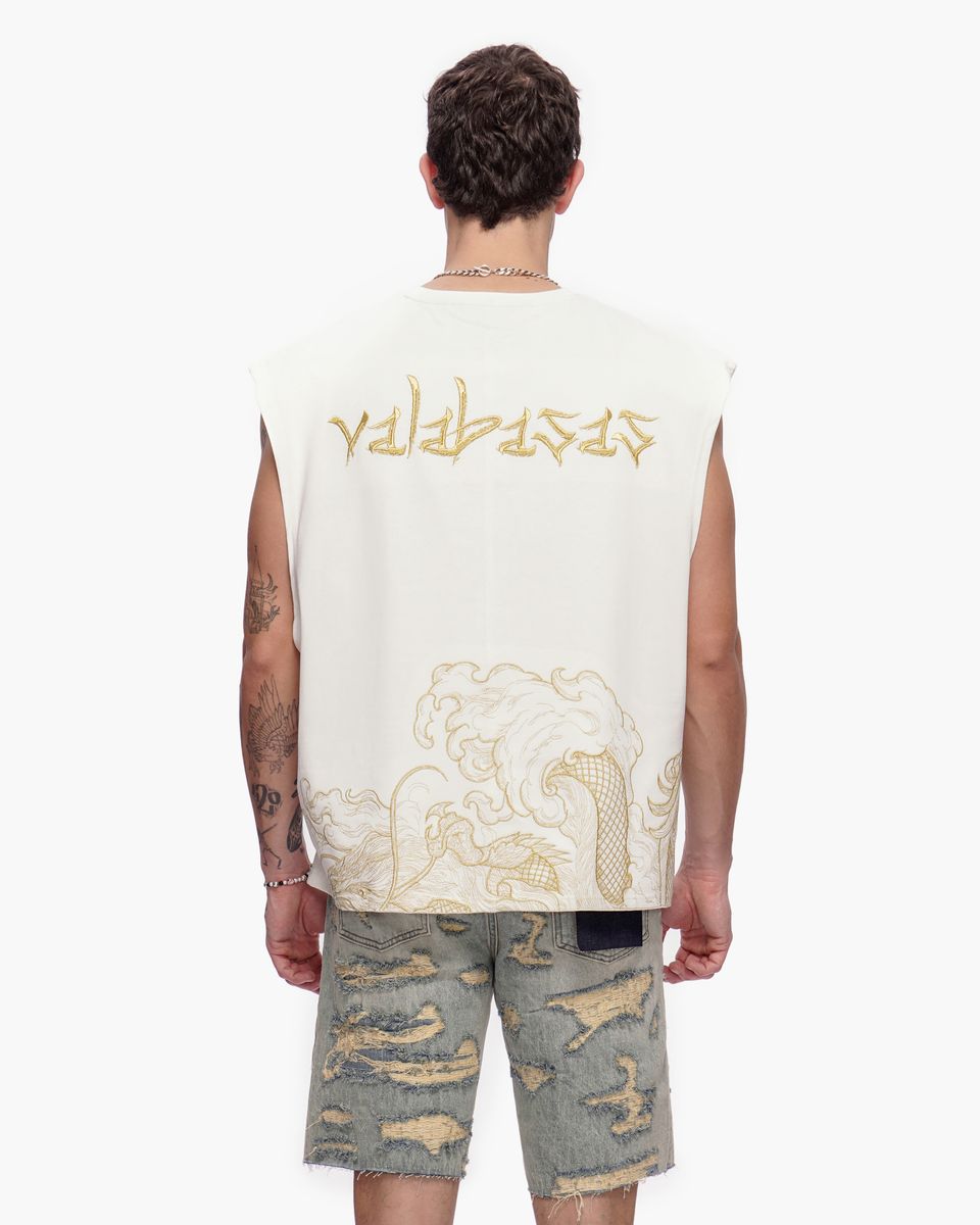 Person wearing a sleeveless shirt with 'valabasas' branding on the back, standing against a white background.