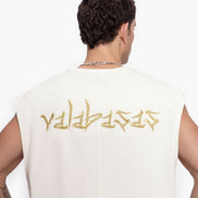 Person wearing a white sleeveless shirt with gold text on the back against a white background