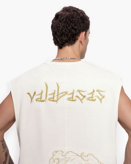 Person wearing a white sleeveless shirt with gold text on the back against a white background