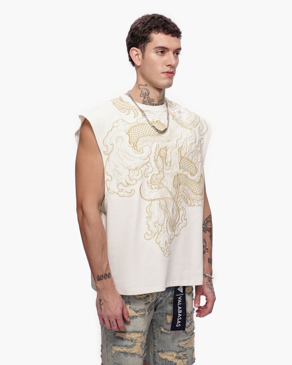 Man wearing a sleeveless embroidered top with a white background