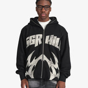 Person wearing a black hoodie with 'SGR HIL' branding on a white background