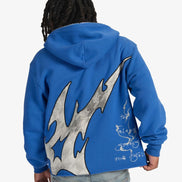 Person wearing a blue hoodie with a large gray and blue design on the back, on a white background
