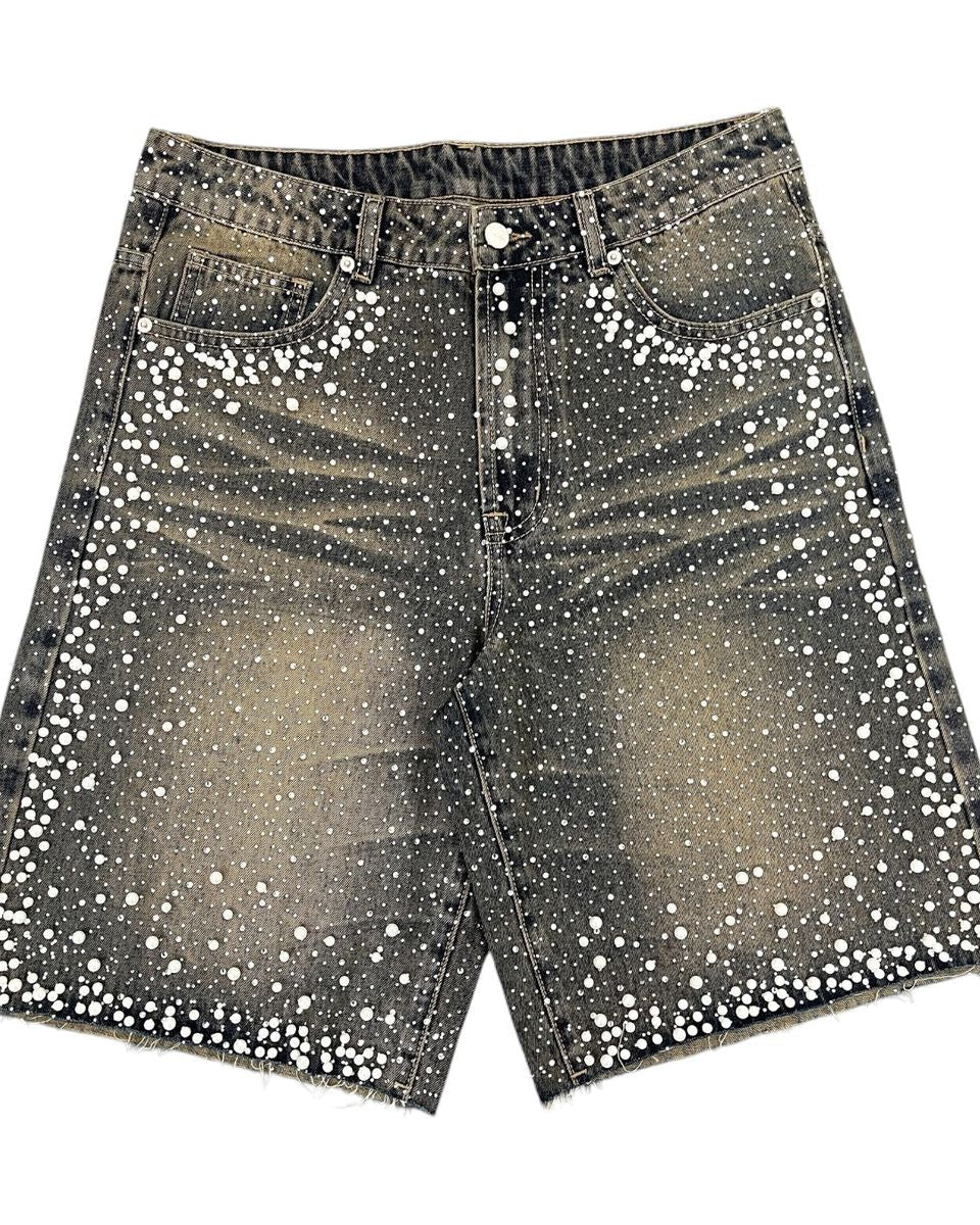Black denim shorts with white sequins on a white background