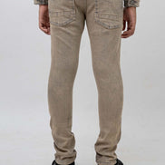 Beige pants worn by a person on a white background