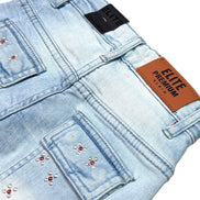Light blue denim shorts with decorative elements and an 'Elite Premium' label.