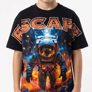 Child wearing a black t-shirt with an astronaut graphic and 'ESCAPA' text on a white background