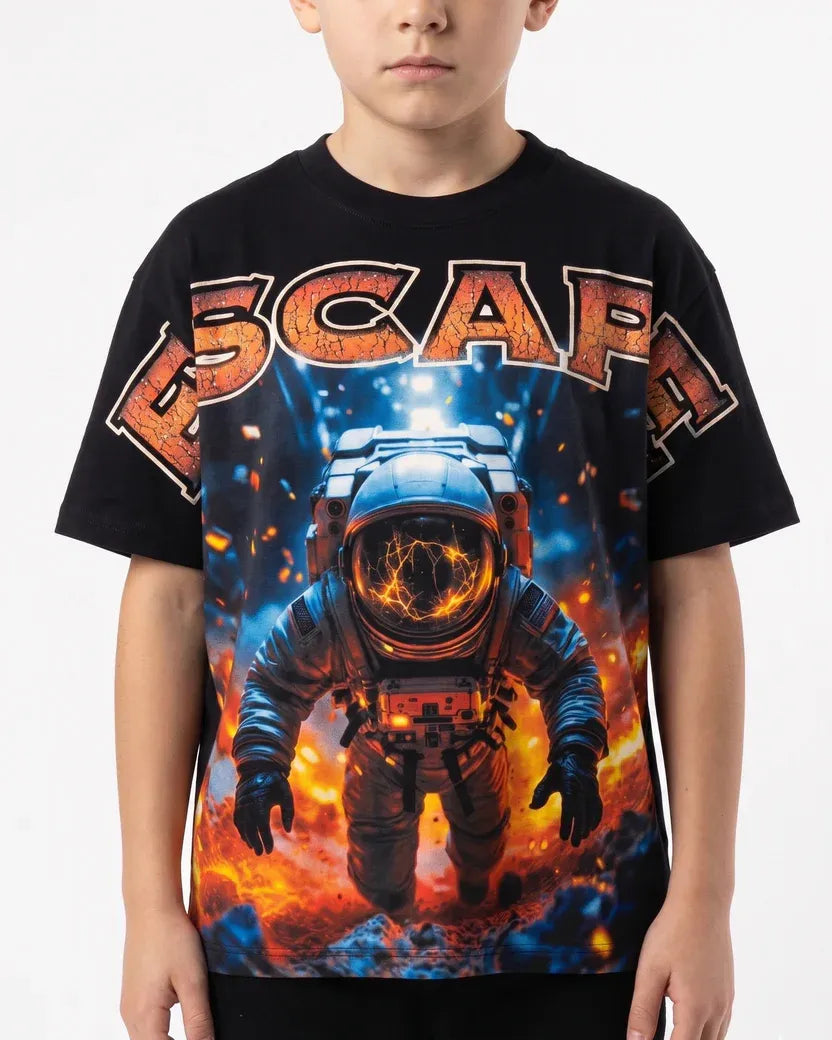 Child wearing a black t-shirt with an astronaut graphic and 'ESCAPA' text on a white background