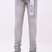 Gray patterned jeans with a visible brand label on a white background