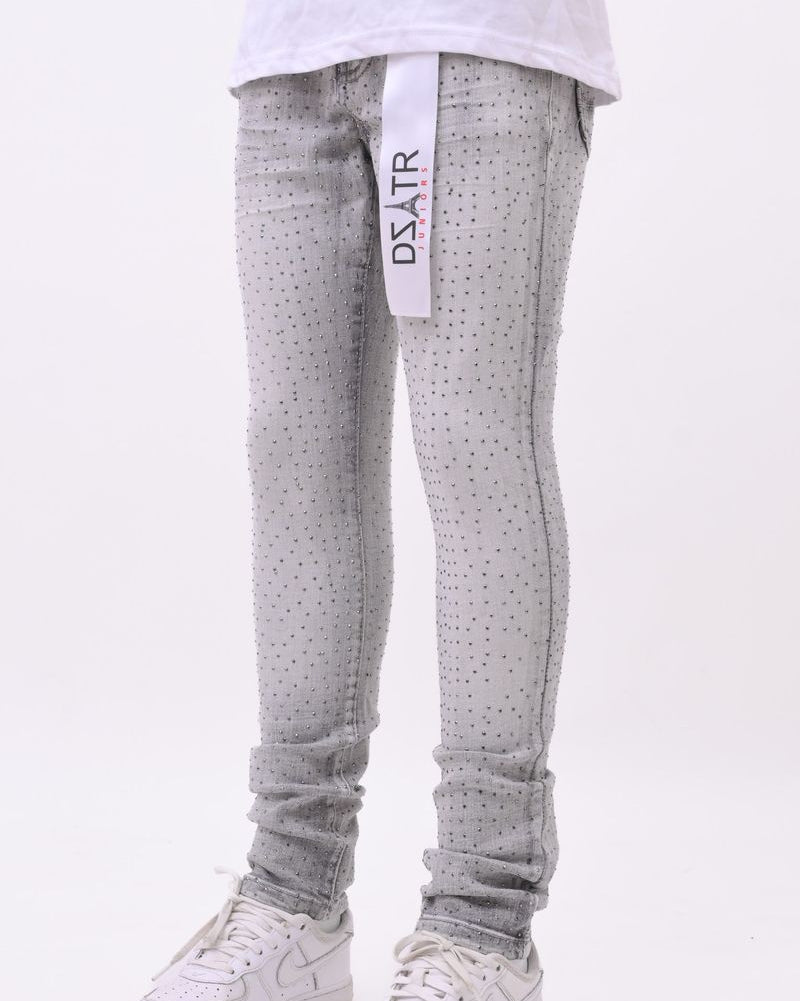 Gray patterned jeans with a brand tag on a white background