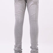 Light gray pants worn by a person on a white background