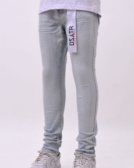 Light blue jeans with a brand tag on a white background