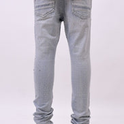 Light blue jeans worn by a person on a white background