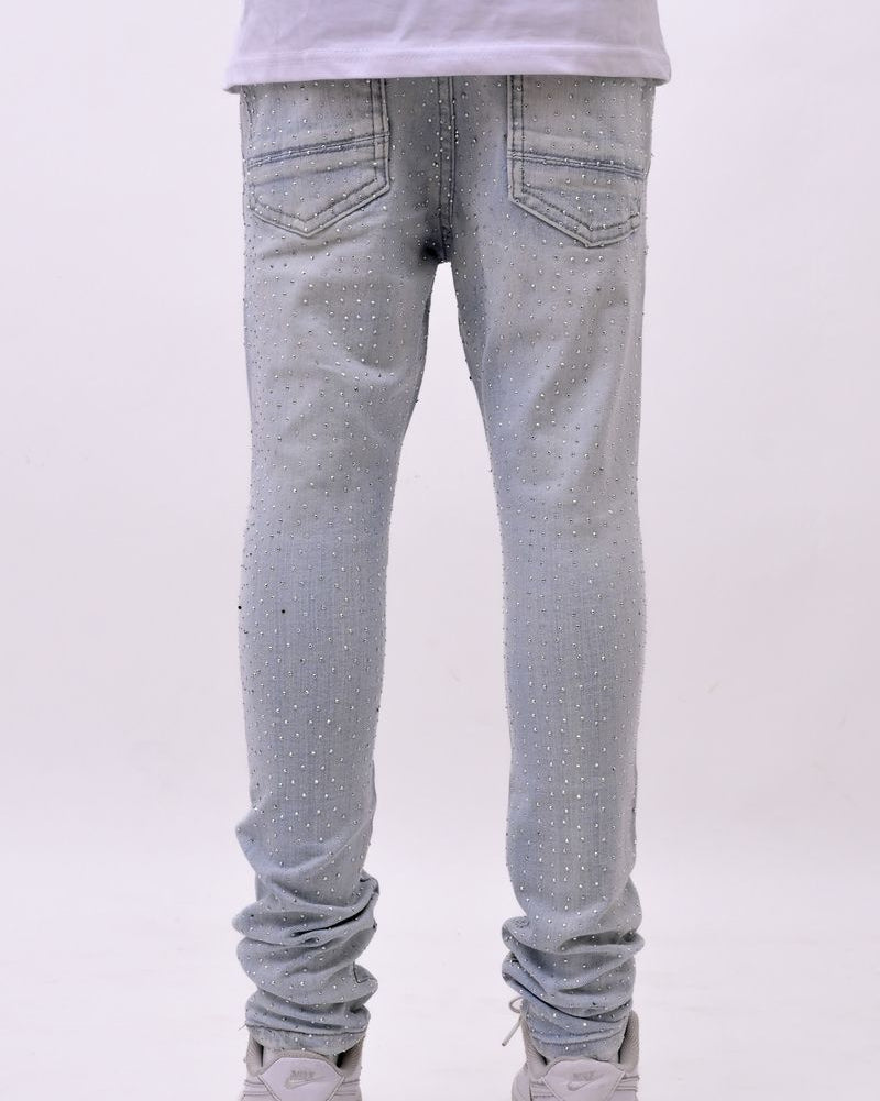 Light blue jeans worn by a person on a white background