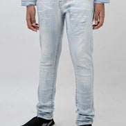 Light blue jeans worn by a person on a white background