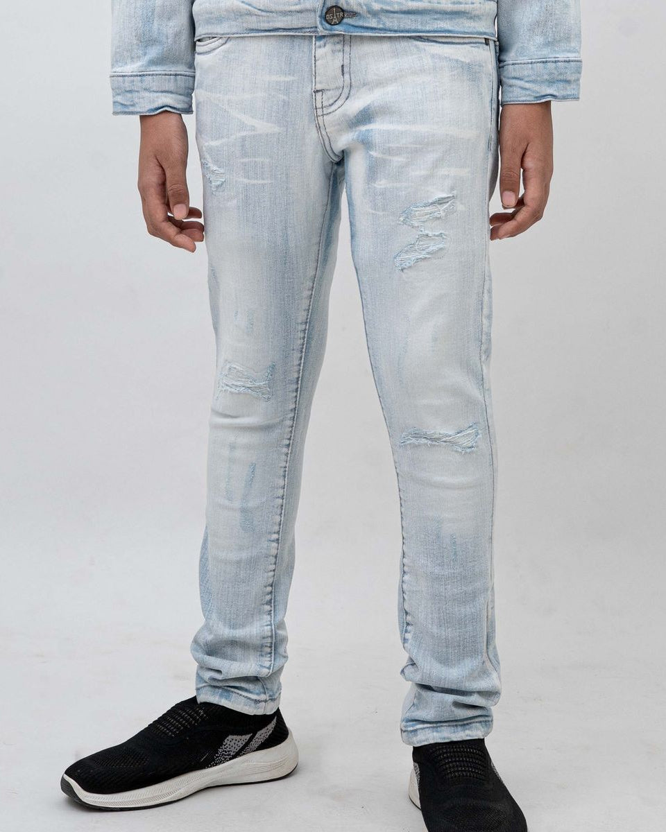 Light blue jeans worn by a person on a white background