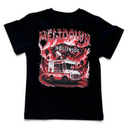 A black short-sleeve t-shirt with a large graphic print on the front featuring a red and white food truck under a 'Hollywood' sign, with 'DENIM CTY' written in stylized red letters above.