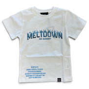 A white short-sleeve t-shirt with a blue graphic print reading 'MELTDOWN ON SUNSET' across the chest and smaller blue text printed near the lower left hem.