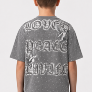 Child wearing a gray t-shirt with 'Love Peace Live' text on the back against a white background